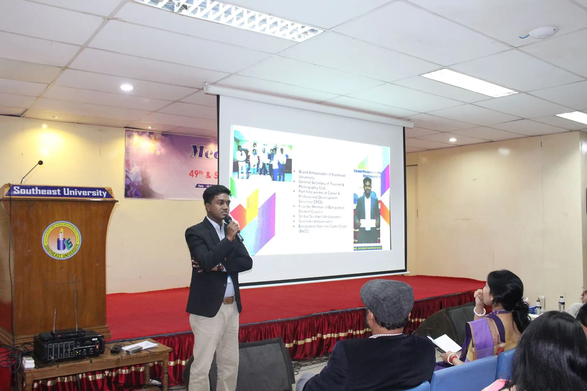 Presenting to an audience at a Southeast University seminar